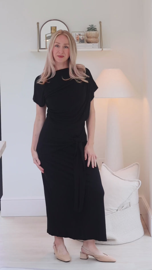 Video showing the discreet feeding access on the SLOANE tie detail midi nursing dress in black